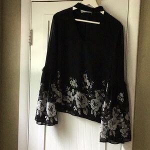 Dressy black and gray top. Flowing sleeves